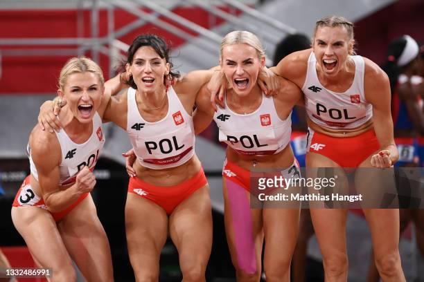 Iga Baumgart-Witan, Malgorzata Holub-Kowalik, Anna Kielbasinska and Justyna Swiety-Ersetic of Team Poland celebrate after competing in the Women's 4...