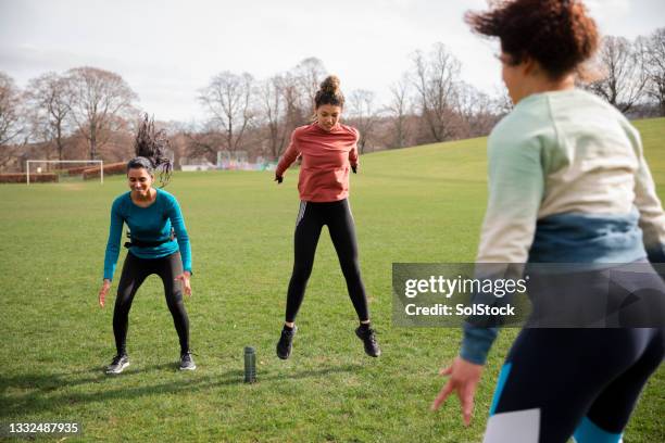 doing burpees at the park - boot camp stock pictures, royalty-free photos & images