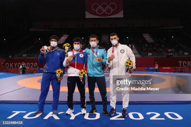 Men's Freestyle 57kg medalists ; silver medalist Kumar Ravi of Team India, gold medalist Zavur Uguev of Team ROC, bronze medalist Nurislam Sanayev of...