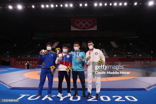 Men's Freestyle 57kg medalists ; silver medalist Kumar Ravi of Team India, gold medalist Zavur Uguev of Team ROC, bronze medalist Nurislam Sanayev of...