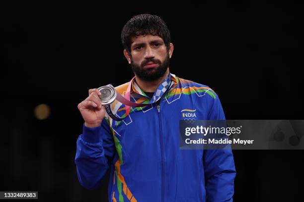 Men's Freestyle 57kg silver medalist Kumar Ravi of Team India poses with his medal during the Victory Ceremony on day thirteen of the Tokyo 2020...