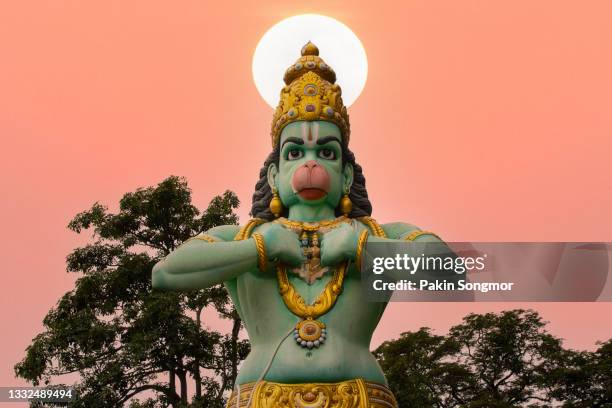 statue of hanuman at batu caves with sunset sky background, kuala lumpur - lord hanuman stock pictures, royalty-free photos & images