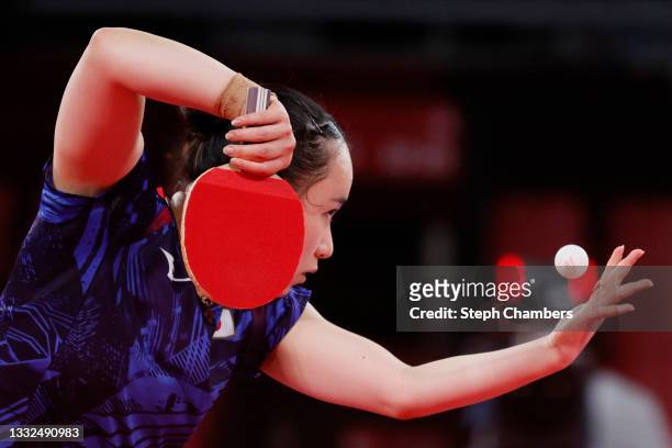 Ito Mima of Team Japan serves the ball during her Women's Team Gold Medal table tennis match on day thirteen of the Tokyo 2020 Olympic Games at Tokyo...