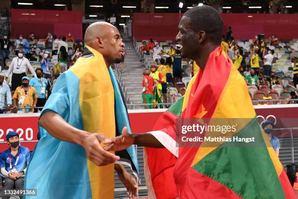 Gold medal winner Steven Gardiner of Team Bahamas and bronze medal winner Kirani James of Team Grenada celebrate after the Men's 400m Final on day...