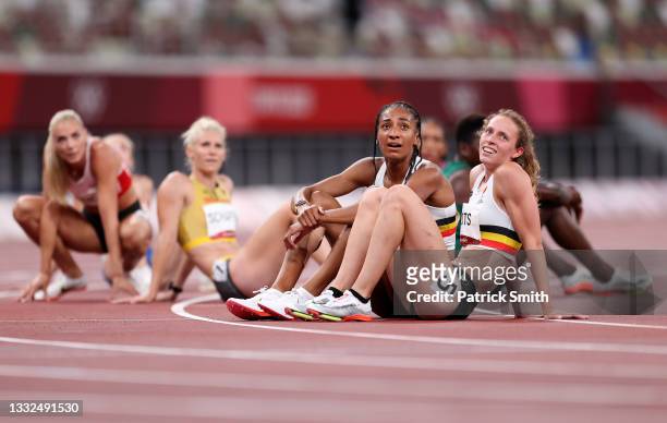 Nafissatou Thiam of Team Belgium and of Noor Vidts Team Belgium react after competing in the Women's Heptathlon 800m heats on day thirteen of the...