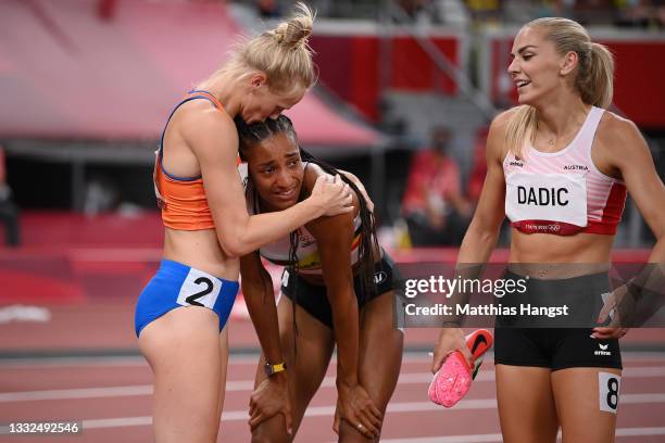 Gold medal winner Nafissatou Thiam of Team Belgium and silver medal winner Anouk Vetter of Team Netherlands react after the Women's Heptathlon on day...