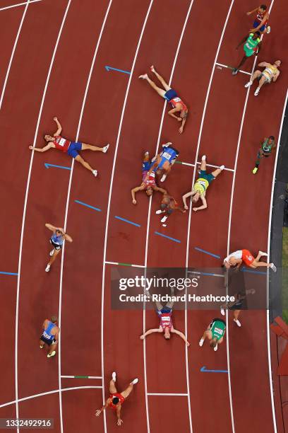 Runners react after they compete in the Men's Decathlon 1500m on day thirteen of the Tokyo 2020 Olympic Games at Olympic Stadium on August 05, 2021...