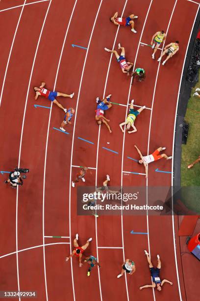 Runners react after they compete in the Men's Decathlon 1500m on day thirteen of the Tokyo 2020 Olympic Games at Olympic Stadium on August 05, 2021...