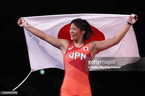 Risako Kawai of Team Japan celebrates defeating Iryna Kurachkina of Team Belarus during the Women's Freestyle 57kg Final on day thirteen of the Tokyo...