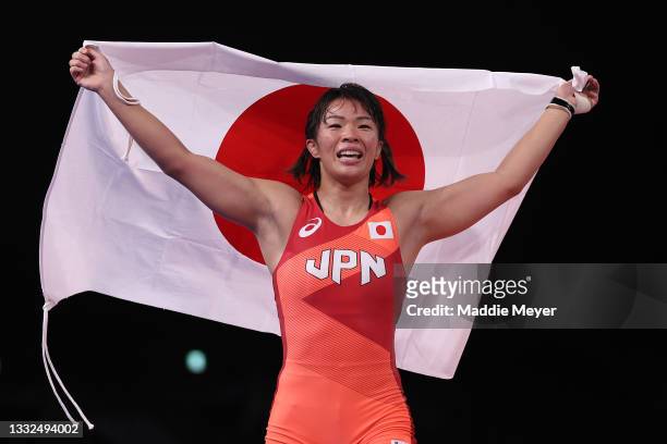 Risako Kawai of Team Japan celebrates defeating Iryna Kurachkina of Team Belarus during the Women's Freestyle 57kg Final on day thirteen of the Tokyo...
