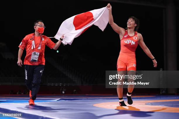 Risako Kawai of Team Japan celebrates defeating Iryna Kurachkina of Team Belarus during the Women's Freestyle 57kg Final on day thirteen of the Tokyo...