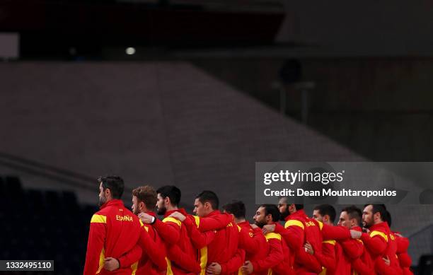 Team Spain stand for their national anthem ahead of the Men's Semifinal handball match between Spain and Denmark on day thirteen of the Tokyo 2020...