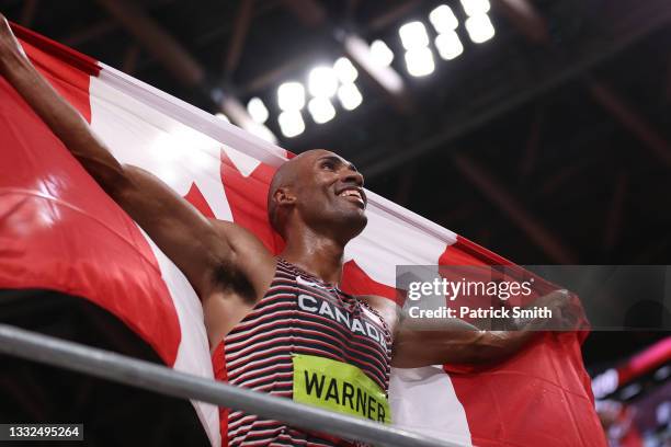 Damian Warner of Team Canada celebrates after winning the gold meldal in the Men's Decathlon on day thirteen of the Tokyo 2020 Olympic Games at...