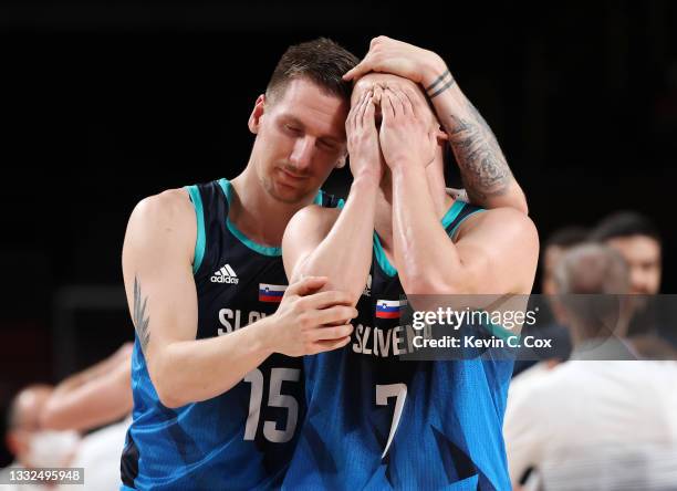Klemen Prepelic of Team Slovenia reacts in disappointment with teammate Gregor Hrovat after his shot to win the game at the buzzer was blocked in a...