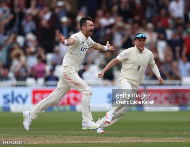 James Anderson of England celebrates taking the wicket of Virat Kohli of India during day two of the First LV= Insurance test match between England...