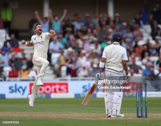 James Anderson of England celebrates taking the wicket of Virat Kohli of India during day two of the First LV= Insurance test match between England...