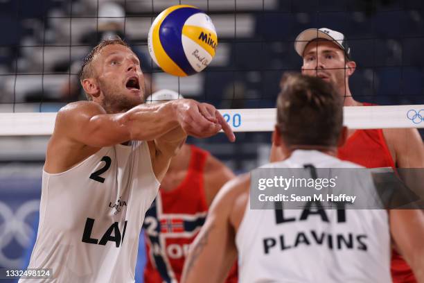 Martins Plavins and Edgars Tocs of Team Latvia compete against Team Norway during Men's Semifinal beach volleyball on day thirteen of the Tokyo 2020...