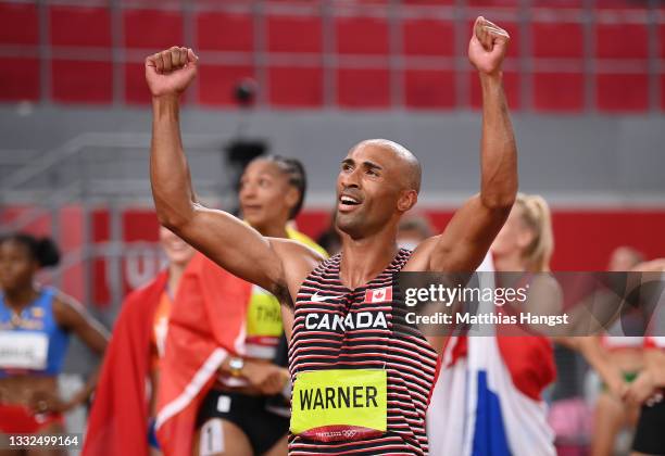 Damian Warner of Team Canada celebrates after winning the gold meldal in the Men's Decathlon on day thirteen of the Tokyo 2020 Olympic Games at...