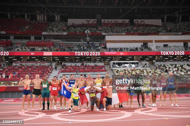 The athletes pose for a photo on the track after the Men's Decathlon on day thirteen of the Tokyo 2020 Olympic Games at Olympic Stadium on August 05,...
