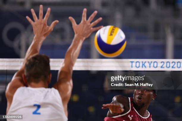 Ahmed Tijan of Team Qatar competes against Oleg Stoyanovskiy of Team ROC during the Men's Semifinal beach volleyball on day thirteen of the Tokyo...