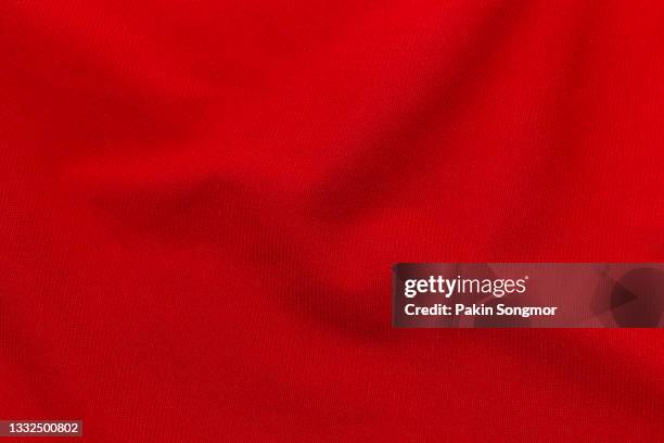 red fabric cloth polyester texture and textile background. - jersey fabric stockfoto's en -beelden