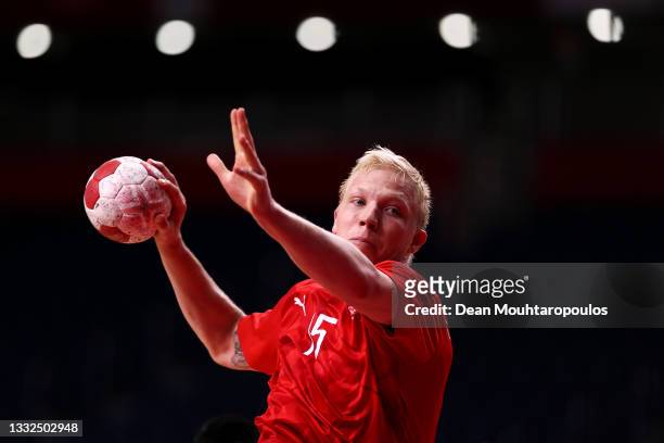 Magnus Saugstrup of Team Denmark shoots at goal during the Men's Semifinal handball match between Spain and Denmark on day thirteen of the Tokyo 2020...