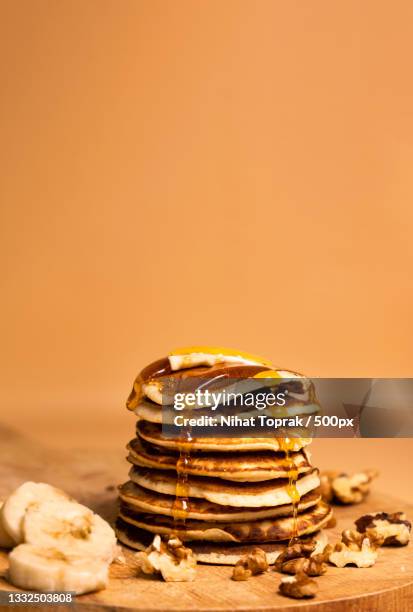 close-up of stacked coins on table - nihat stock pictures, royalty-free photos & images