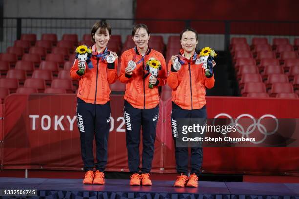 Team Japan players Hirano Miu, Ishikawa Kasumi and Ito Mima pose with their medals during the medal ceremony for the Women's Team table tennis on day...