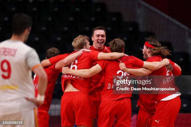 Raul Entrerrios Rodriguez of Team Spain looks on as Team Denmark celebrate after winning the Men's Semifinal handball match between Spain and Denmark...