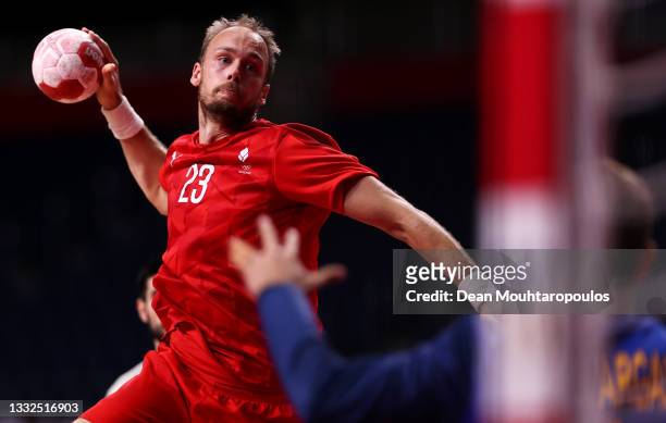 Henrik Toft Hansen of Team Denmark shoots at goal as Gonzalo Perez de Vargas Moreno of Team Spain looks to save during the Men's Semifinal handball...