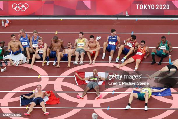 Gold medalist Damian Warner of Canada, silver medalist Kevin Mayer of France and bronze medalist Ashley Moloney of Australia lead the celebrations...