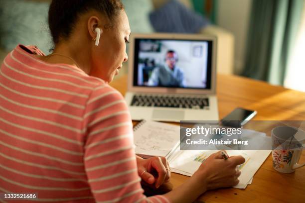 black woman having a virtual meeting with her financial consultant - e learning stock pictures, royalty-free photos & images