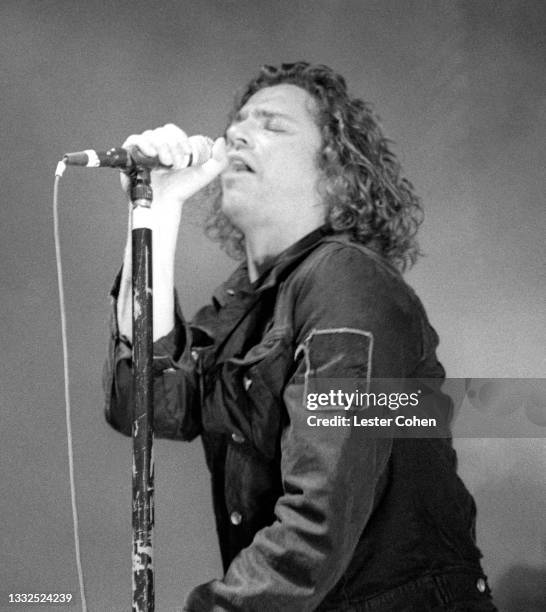 Australian musician, singer-songwriter and actor Michael Hutchence , of the Australian rock band INXS, sings on stage during the 1993 Get Out Of The...