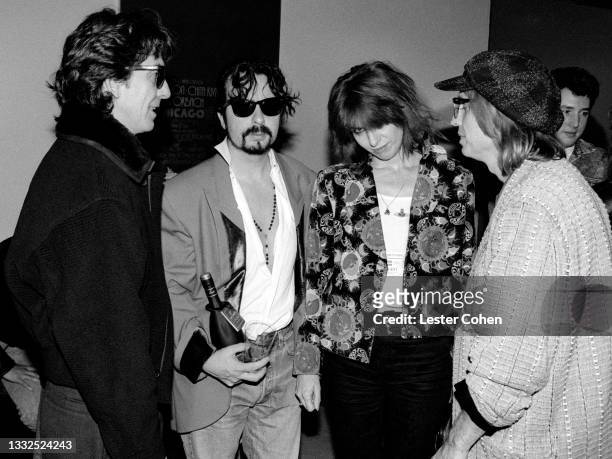 English musician, singer-songwriter, and music and film producer George Harrison , of the English-American supergroup The Traveling Wilburys, English...