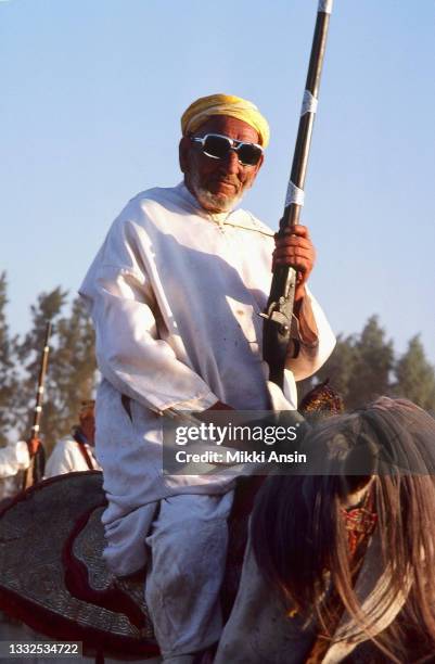 Eight hundred and twelve Berber horsemen came down from the hills to participate in this first national Fantasia, and are shown here milling around...