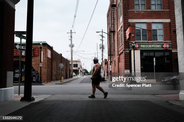 People walk down the street on August 05, 2021 in Springfield, Missouri. According to the latest numbers from the state’s health department, only a...