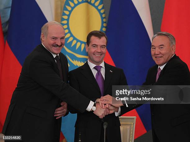 Russian President Dmitry Medvedev , Belarus's President Alexander Lukashenko and Kazakh President Nursultan Nazarbayev shake hands during their...