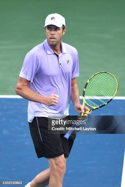 Sam Querrey of the United States celebrates a shot during a match against returns a shot during a match agains on Day 3 during the Citi Open at Rock...