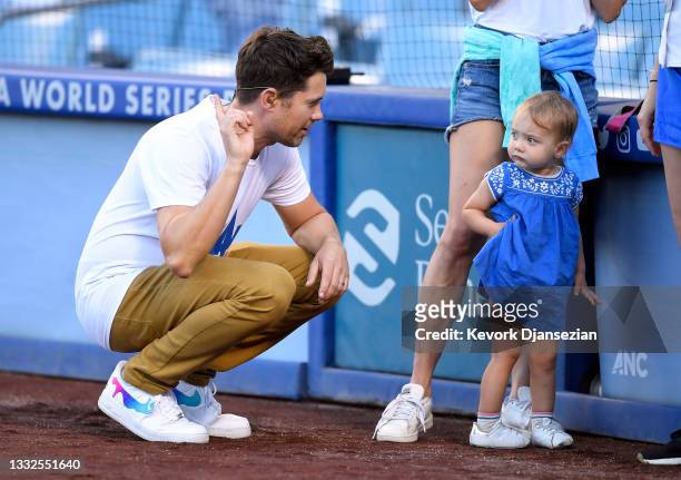Drew Seeley, a Canadian-American actor, singer and dancer, talks with his one year old daughter Ember Florence Seeley before singing the National...