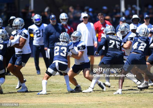 Dallas Cowboys players run through drills during training camp at River Ridge Complex on August 3, 2021 in Oxnard, California.