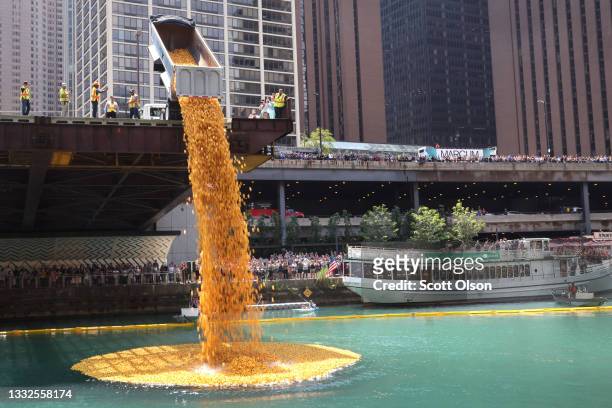 Rubber ducks are dropped into the Chicago River at the start of the Chicago Ducky Derby on August 05, 2021 in Chicago, Illinois. Derby organizers...