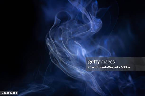 close-up of smoke against black background - smoke stock pictures, royalty-free photos & images