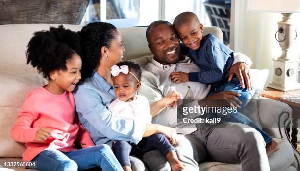 african-american family, three children at home on sofa - large family stock pictures, royalty-free photos & images