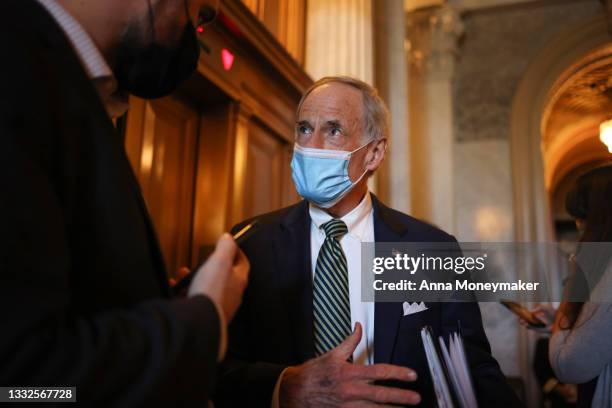 Sen. Tom Carper speaks to a reporter outside of the Senate Chambers in the U.S. Capitol building on August 05, 2021 in Washington, DC. The Senate...