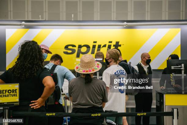 People wait in line at a Spirit Airlines counter, at the George Bush Intercontinental Airport, on August 05, 2021 in Houston, Texas. Spirit and...