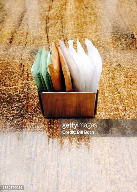 sugar substitutes in a metal container on a shinny granite table with light reflections - part of a series - artificial sweetener imagens e fotografias de stock