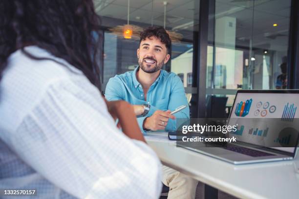 business colleagues having a conversation - young adult laptop stock pictures, royalty-free photos & images