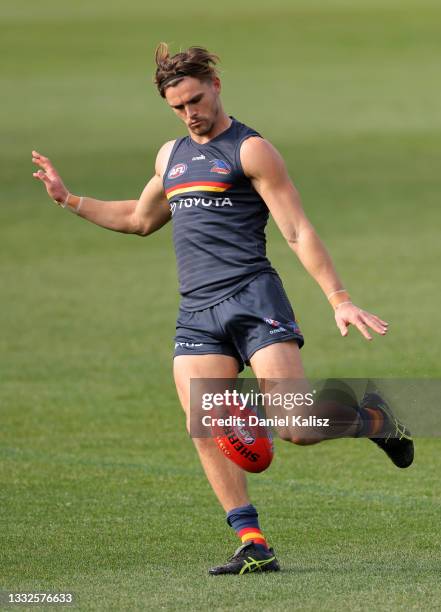Ben Keays of the Crows kicks the ball during an Adelaide Crows AFL training session at Adelaide Oval on August 05, 2021 in Adelaide, Australia.