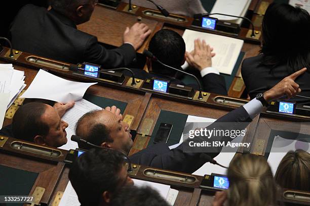 Popolo della Liberta' member and former Prime Minister Silvio Berlusconi and Angelino Alfano attend a second vote of confidence for the government in...