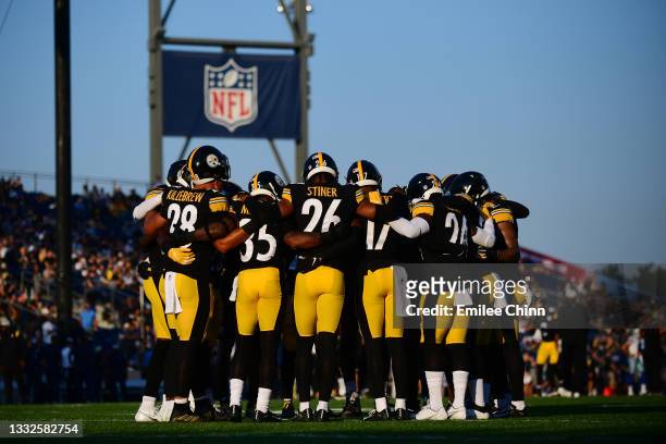 The Pittsburgh Steelers huddle ahead of the 2021 NFL preseason Hall of Fame Game against the Dallas Cowboys at Tom Benson Hall Of Fame Stadium on...